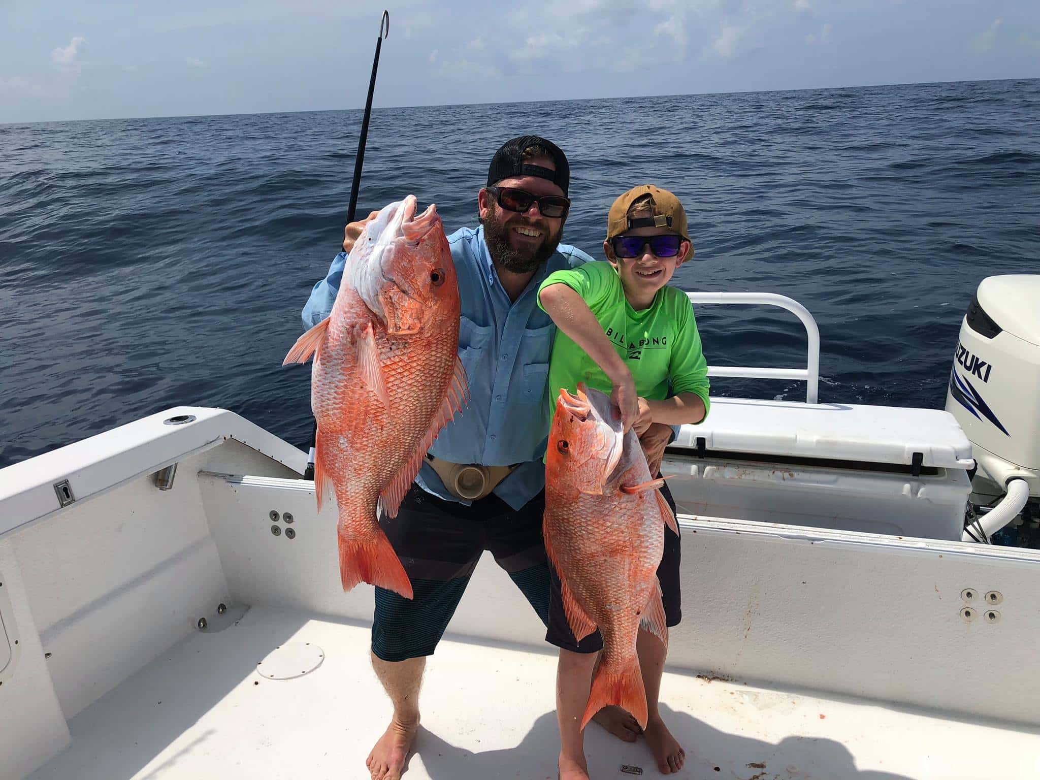 Adult & Kid with Red Snapper