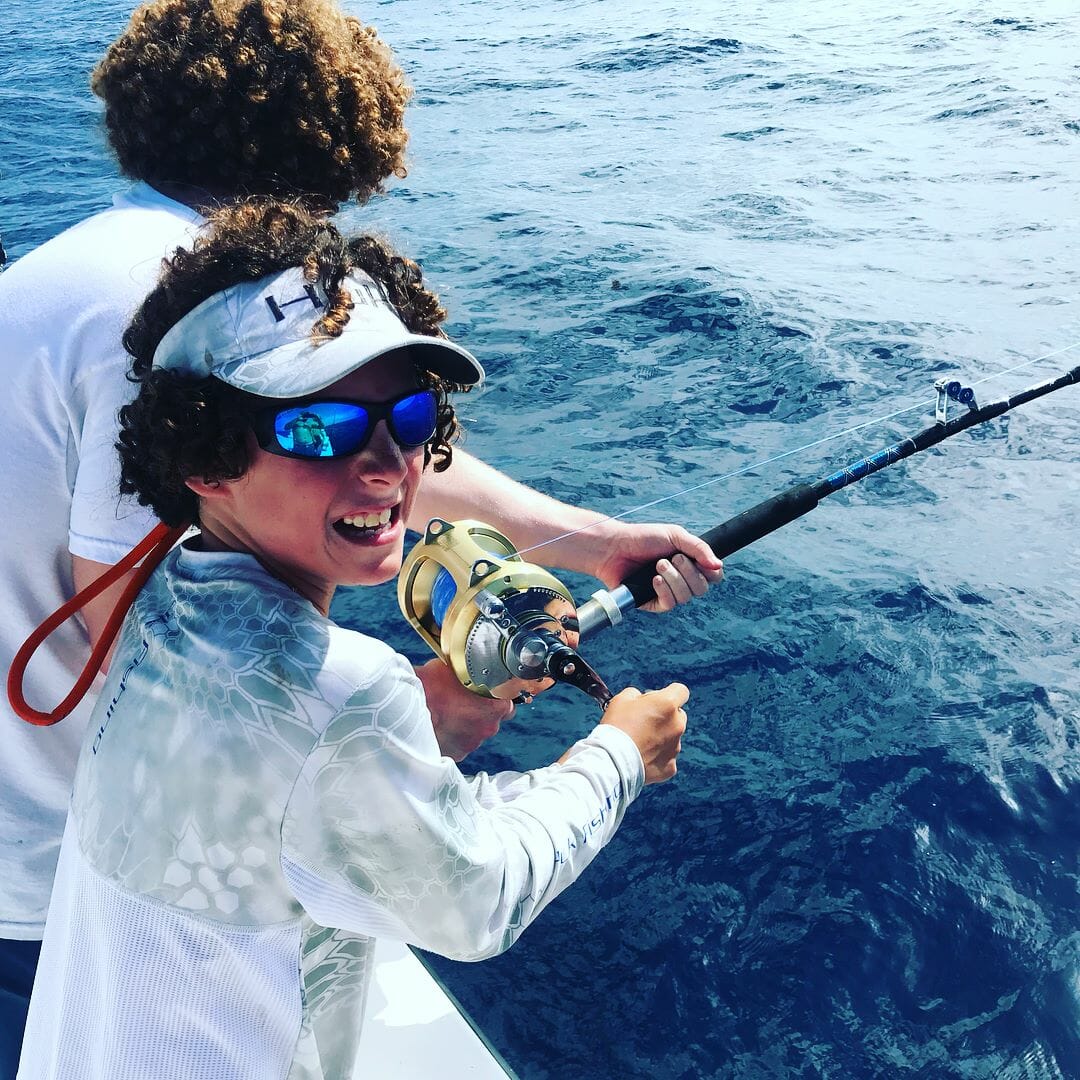 Boy with Fishing Rod - Offshore Fishing Trip