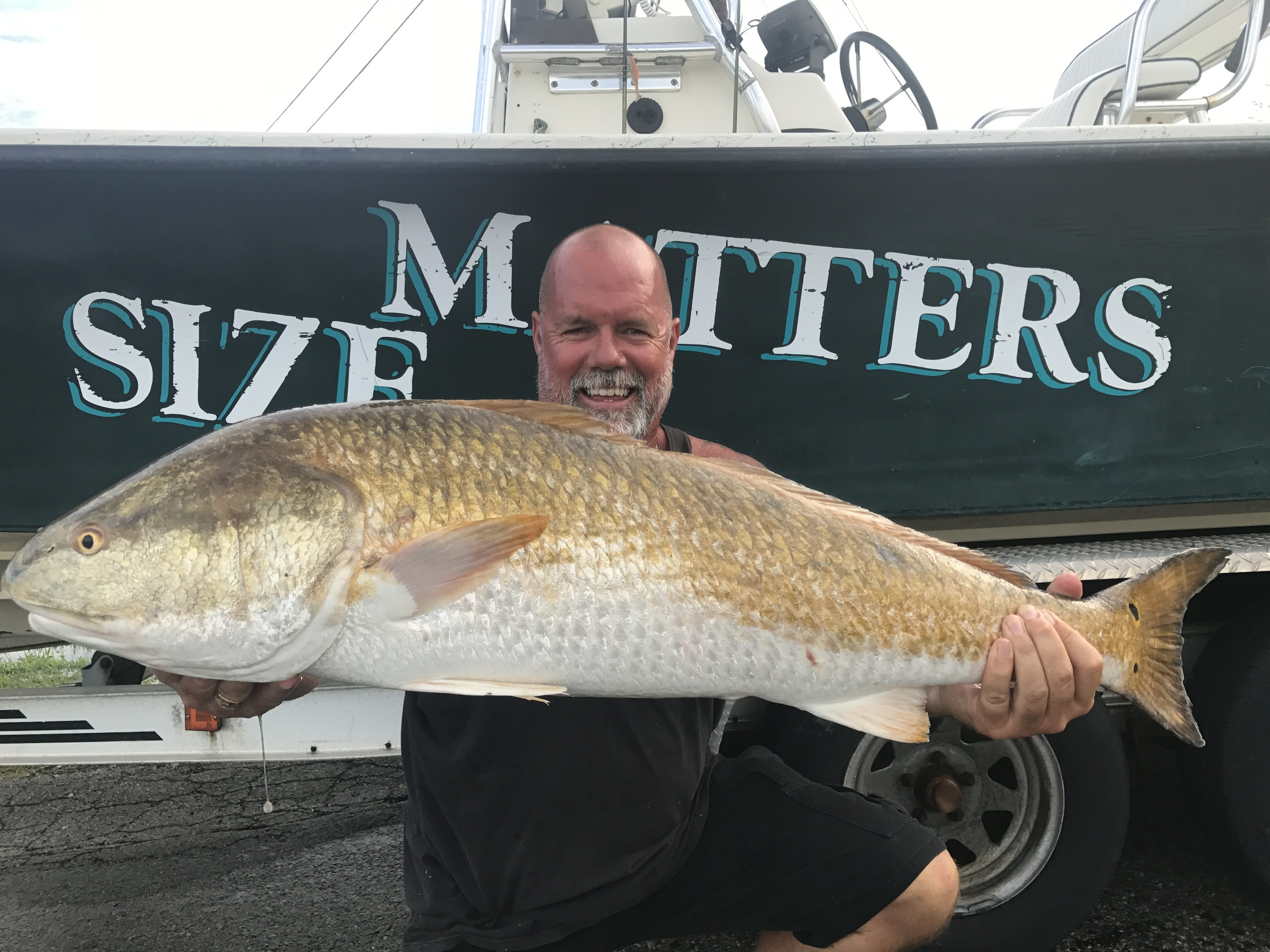 Size Matters - Man with redfish